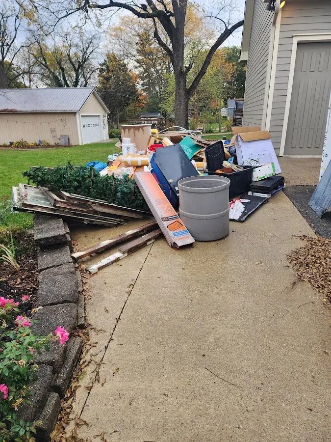 Dumpster being loaded with debris for Demolition Dumpster Rental in Castroville